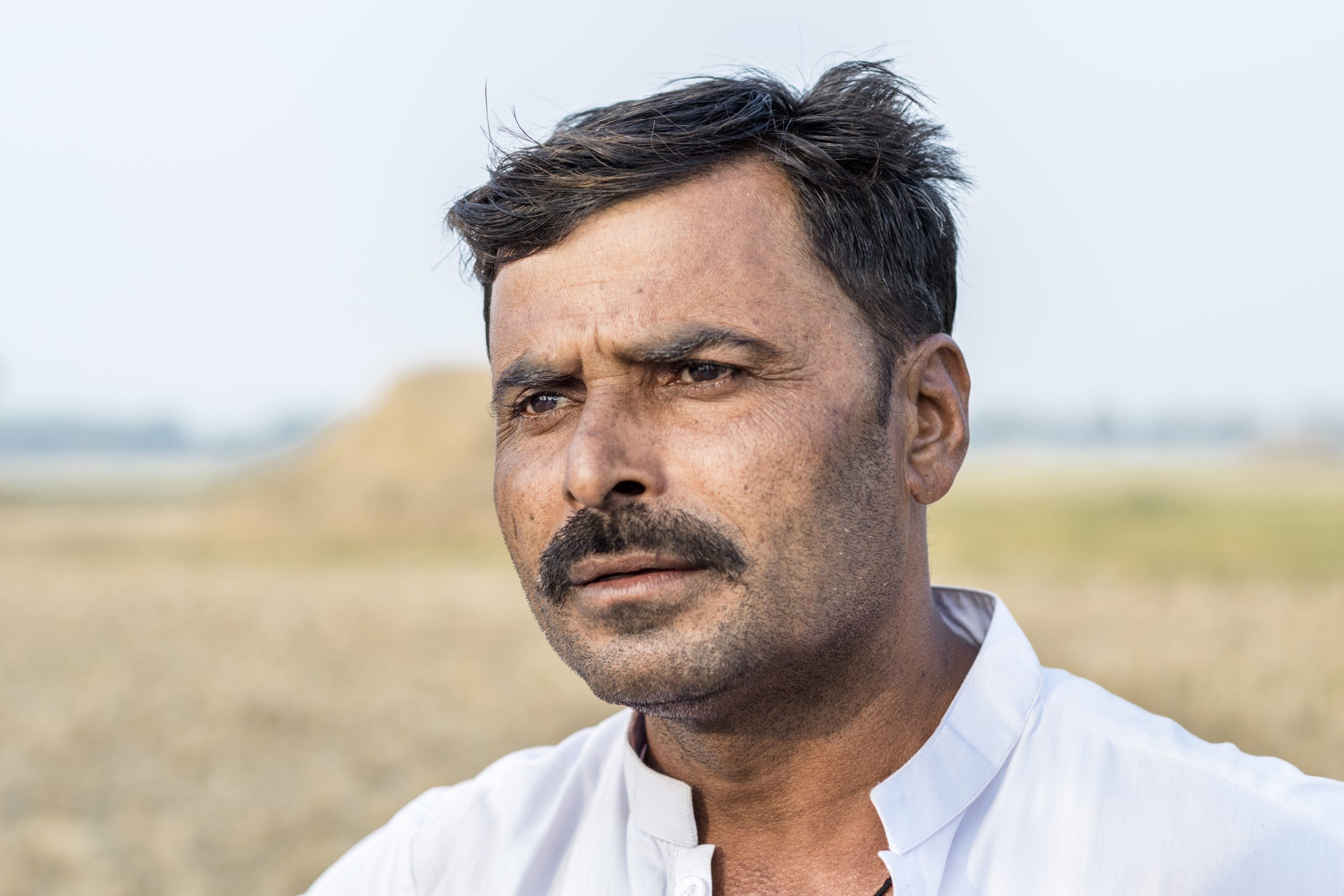asian farmer is in shock after loosing his plants cause of climate change