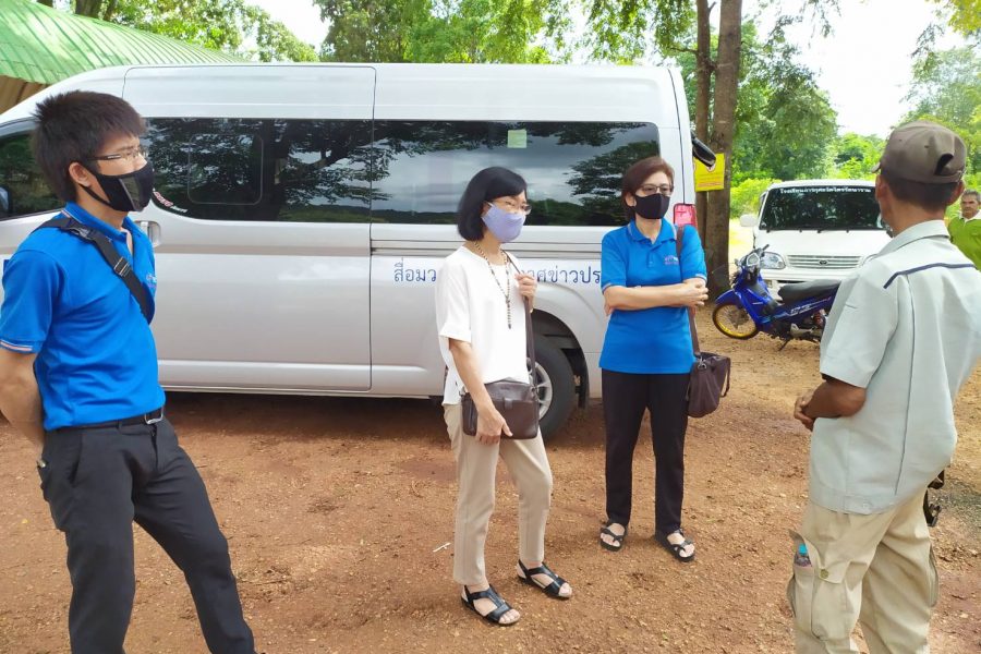 Visiting and distributing radios to village in Thailand.